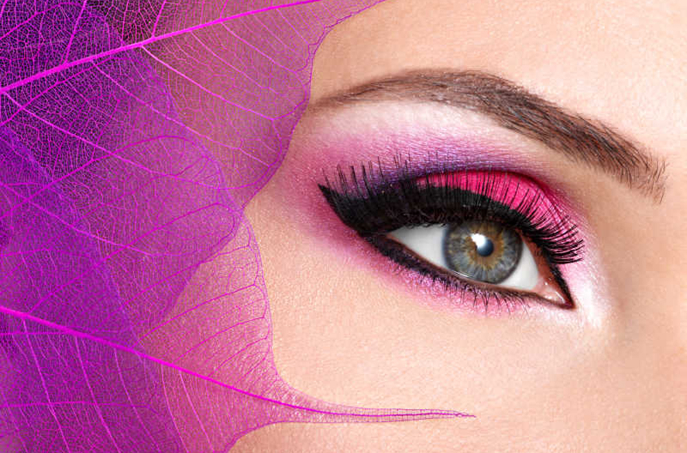 female eye with  beautiful fashion bright pink makeup